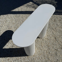 Load image into Gallery viewer, Top view of The Plinth Table, showing its slim oval shape and clean white finish, designed for long cake styling.