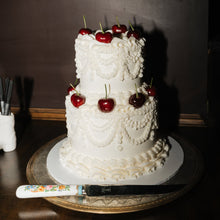 Load image into Gallery viewer, Classic white buttercream wedding cake with vintage pearl piping and round tiers