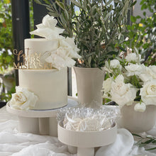 Load image into Gallery viewer, Ethereal two-tier cake with fresh roses styled for a romantic celebration