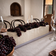 Load image into Gallery viewer, Long table cake styled with grapes on a wedding dessert table by Spodeli
