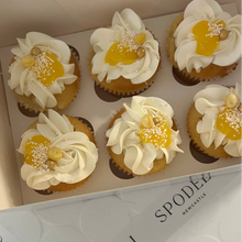 Load image into Gallery viewer, Box of lemon cupcakes with vanilla buttercream in Spodeli bakery gift box