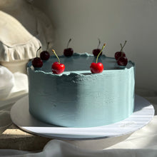 Load image into Gallery viewer, The European Cherry Edit, a minimal editorial cake finished in blue chocolate ganache with cherries by Spodeli