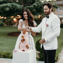 Load image into Gallery viewer, Side view of a three-tier cake with warm summer tones and citrus accents
