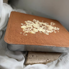 Load image into Gallery viewer, Close-up of tiramisu with cocoa dusting and delicate floral stencil detail
