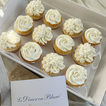 Load image into Gallery viewer, White on white vanilla cupcakes arranged in bakery box with textured frosting swirls