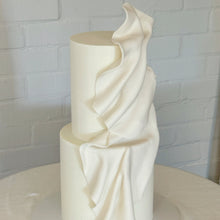 Load image into Gallery viewer, Sculptural two tier wedding cake with soft draped fondant design
