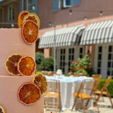 Load image into Gallery viewer, Euro summer hues cake displayed at a wedding celebration at Redleaf Wollombi 
