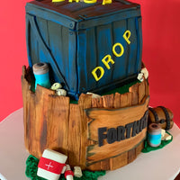 Side detail of a Fortnite themed novelty cake with textured timber panels and sculpted game elements by Spodeli 