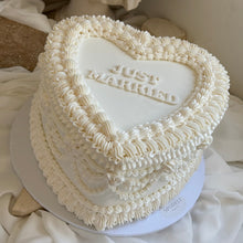 Load image into Gallery viewer, Heart shaped white vintage cake with pearl finish and layered piping detail
