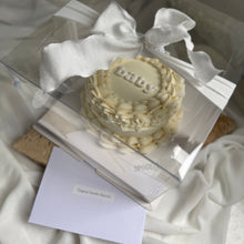 Load image into Gallery viewer, Mini round gender reveal cake presented in clear gift box with ribbon
