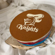 Load image into Gallery viewer, Newcastle Knights Grand Final red and blue tiramisu with cocoa stencil by Spodeli
