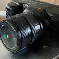 Angled view of a camera cake showing lens detail and sculpted camera form