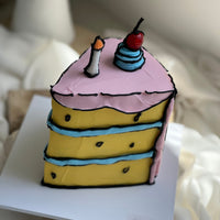 Detail view of an illustrated cartoon slice cake showing hand-piped outlines and layered design