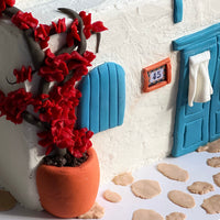 Close-up detail of hand-modelled bougainvillea on a Mediterranean style house cake