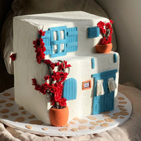 Close-up detail of hand-modelled bougainvillea on a Mediterranean style house cake