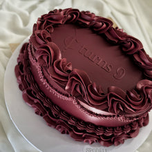 Load image into Gallery viewer, Maroon oval vintage cake with 'ycl turns 9' text on top 
