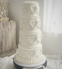Load image into Gallery viewer, Close-up of buttercream piping on a wedding tower cake
