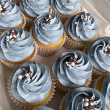 Load image into Gallery viewer, Assorted custom colour swirl cupcakes arranged in bakery box
