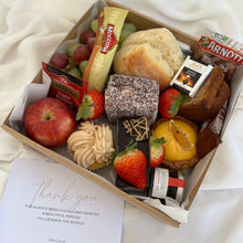 Load image into Gallery viewer, Catering box containing cupcakes, fresh berries, grapes, biscuits and chocolate treats, shown with a birthday card
